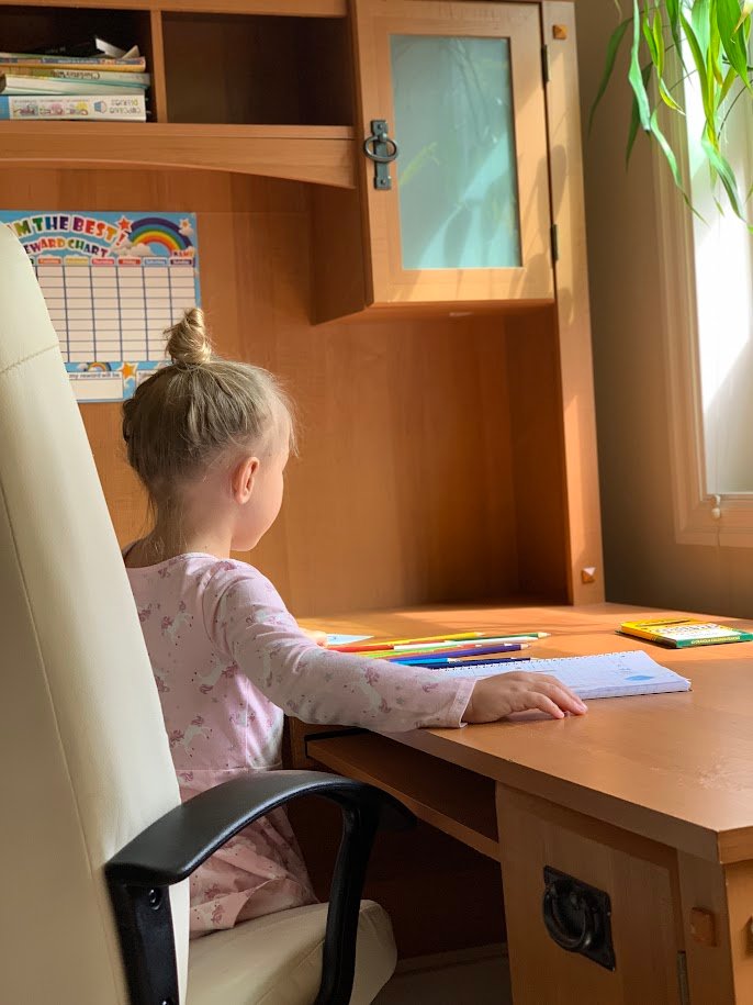 Child working at homeschool desk